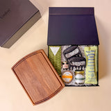 Gather & Graze entertaining gift set with charcuterie board, artisan food items, and grilling accessories arranged for a gourmet grazing experience.