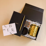 Modern office gift box with gold pen, insulated tumbler, and espresso martini candy