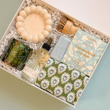 Luxury new homeowner gift box with candle, room spray, and modern home decor accents