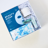 All is Calm Holiday Gift Box, blue gift box, patchology beauty sleep mask, calm lavender candle, compartres marshmallow crips chocolate bar, poppy pout sweet mint lip balm, heritage hand cream - white gardenia, Confete gifts and party boxes