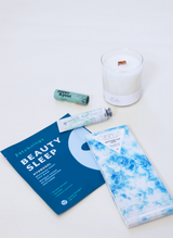 All is Calm Holiday Gift Box, blue gift box, patchology beauty sleep mask, calm lavender candle, compartres marshmallow crips chocolate bar, poppy pout sweet mint lip balm, heritage hand cream - white gardenia, Confete gifts and party boxes