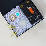 New Year's Eve 2023 Gift Box, JoyJolt Claire Champagne Flutes, Seattle Chocolate Champagne Truffles, Sugarfina Champagne Bubbles, Party Horns, Soi Petite Prosecco Candle, Confete gifts and part boxes