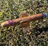 Beaver Tail Golf Club Alfred cigar holder and golf divot tool shown ready for use on the golf course.
