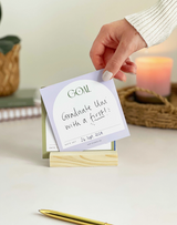 Goal Setting Cards by Aim Studio Co. with modern typography and wooden display stand.