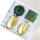 Mistletoe Holiday Gift Box. Holiday 2023 Gift Box including Soi Mistletoe and Holly Candle, 2 Gold Wine Glasses, and Via Mercato Joy Matches