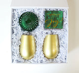 Mistletoe Holiday Gift Box. Holiday 2023 Gift Box including Soi Mistletoe and Holly Candle, 2 Gold Wine Glasses, and Via Mercato Joy Matches