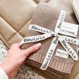 Luxurious organic cotton knit swaddle from Bleu La La, designed to keep newborns cozy, secure, and comfortable.