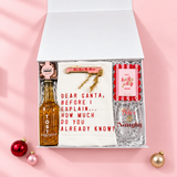 Holiday Hostess gift box with alcohol-free TÖST, a festive wine glass, tea towel, candy and photo frame