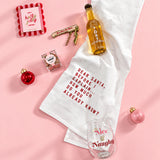 Playful holiday thank-you gift for a hostess with a tea towel, wine opener, photo frame and festive treats