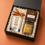 Angled view of the Mini Holiday Spirit cocktail gift box packed in a small black box