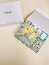Confete New Baby Gift Box displayed with branded lid and ribbon for an elegant presentation.