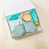Mini self-care gift box featuring cozy and soothing essentials to promote relaxation and tranquility.