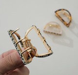 Compact Adorro Rosalie half moon metal claw clip designed for secure hair styling with a minimalist metallic finish.