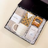 Angled view of the Warm + Cozy gift box—perfect autumn or holiday present for anyone who loves cozy nights.