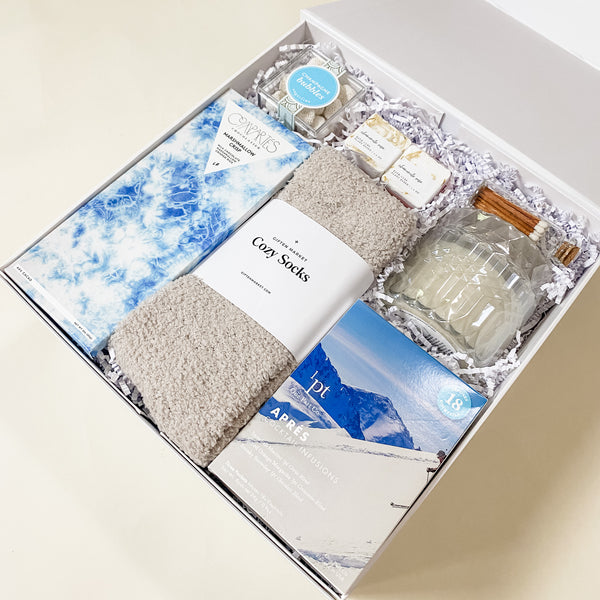 Apres Gift Box, self care, cozy socks, marshmello crisp chocolate, candle, sugarfina champagne bubbles, bath bomb, confete party