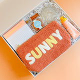 Summer Fun thank you gift box featuring SUNNY pouch, peach bellini candy, and happy hour themed gifts