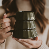 Green tree-shaped holiday mug for coffee, cocoa, or tea.