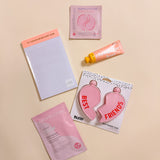 Luxury friendship care package gift box including heart flask, happy hour notepad, calming sheet mask, rose eye gels, and shea butter lotion.