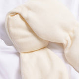 Bone Nodpod Weighted Sleep Mask styled as a cozy self-care gift