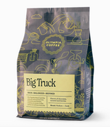 Front of Olympia Coffee Company Big Truck Coffee Blend bag featuring illustrated gray and yellow packaging, medium-dark roast