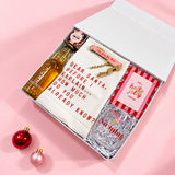 Alcohol-free Christmas hostess gift with TÖST sparkling tea, a Nice and Naughty glass and Sugarfina candy
