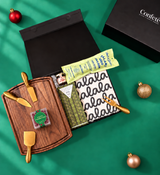Corporate holiday gift box featuring salami, Mike’s Hot Honey, chocolate chip cookies and sugared cranberries.