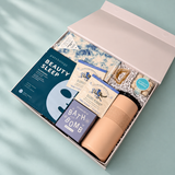 Relax and recharge self-care gift box filled with thoughtful wellness essentials and gourmet chocolate.
