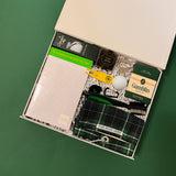 Luxury golf gift box with golf tees, premium snacks, drink accessories, and curated gifts for golf lovers.