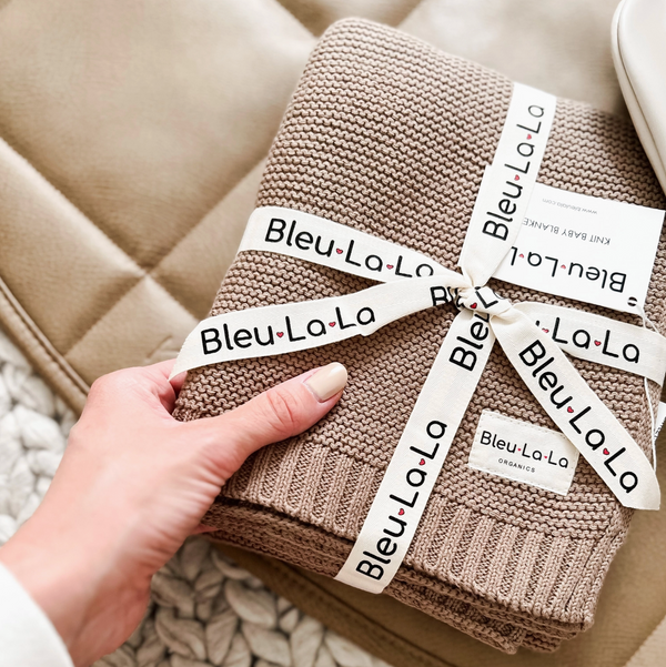 Luxurious organic cotton knit swaddle from Bleu La La, designed to keep newborns cozy, secure, and comfortable.