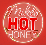 Gourmet 1.5 oz Mike's Hot Honey mini jar filled with sweet and spicy honey for drizzling on food and snacks