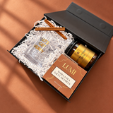 Angled view of the Mini Holiday Spirit cocktail gift box packed in a small black box
