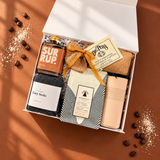 Angled view of the Slow Mornings gift box with coffee, Old Fashioned Pancake Mix and cozy morning essentials.