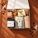 Slow Mornings coffee gift box with a travel tumbler, coffee, cinnamon bun syrup, pancake mix and cozy socks.