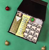 Budget-friendly holiday host gift featuring gourmet salami, Mike’s Hot Honey, cookies and Sugarfina cranberries.
