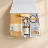 Thinking of You gift box with sourdough starter, bread dip, candle, hand cream, tea towel and chocolates.